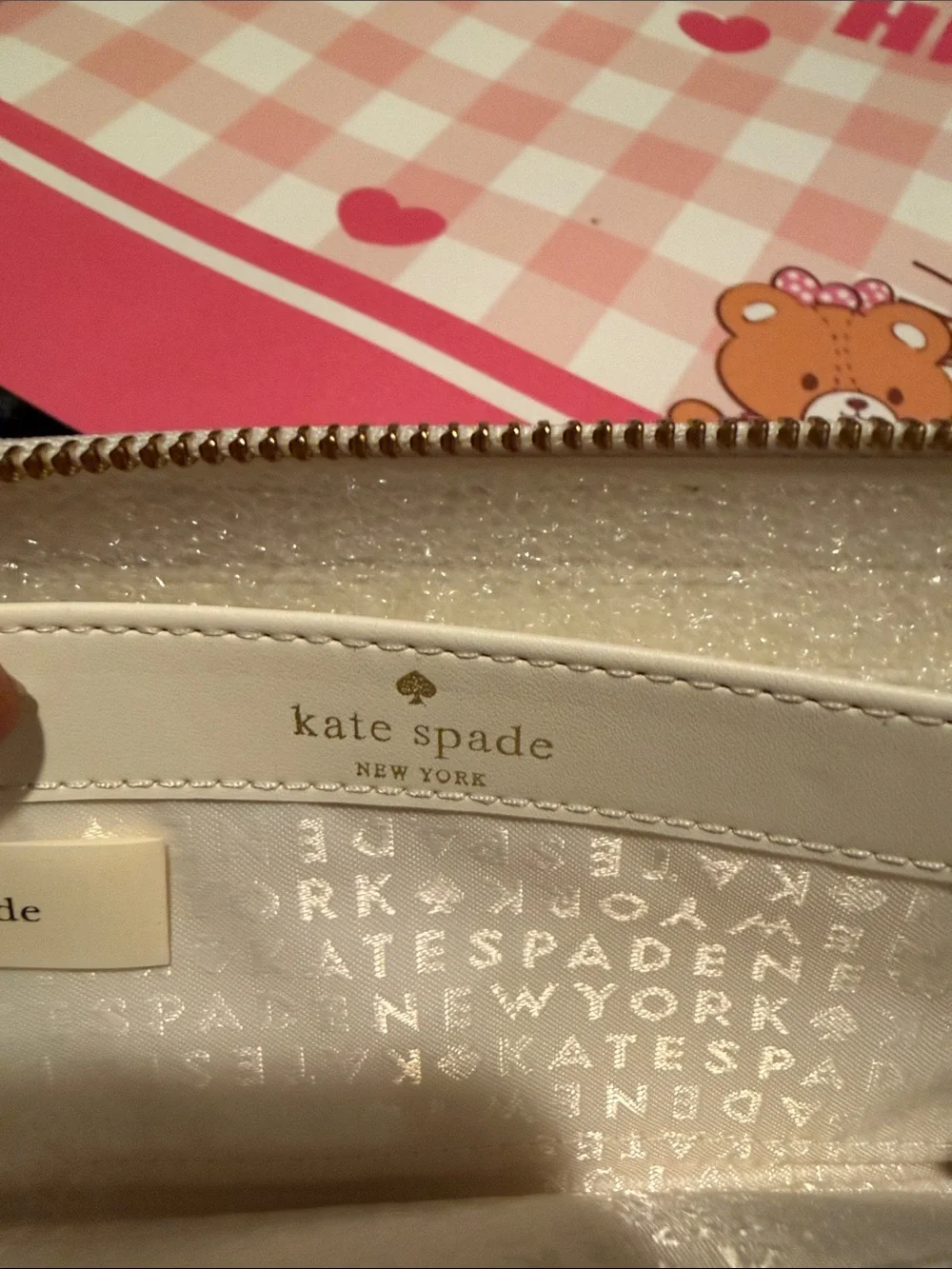 kate spade White Pebbled Leather Zip Wallet with Black Bow and Gold Bar
